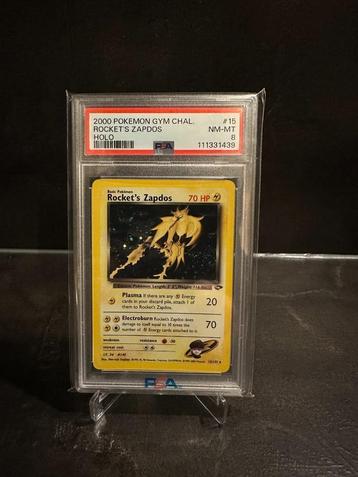 Pokémon Rocket's Zapdos Holo - PSA 8 beschikbaar voor biedingen