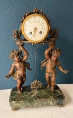 Pendule met putti’s, Ophalen