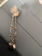 Verzilverde Suikertang met Bladmotief, Ophalen