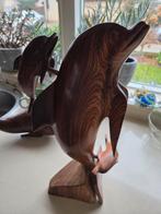 Houten dolfijnenbeeld, Ophalen