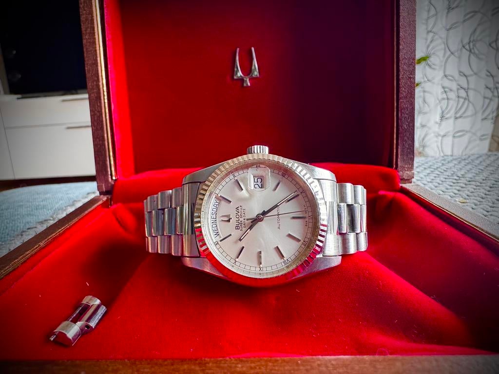 BULOVA SUPER SEVILLE DAYDATE met box ( rolex), Ophalen of Verzenden, Staal, Overige merken, 1960 of later