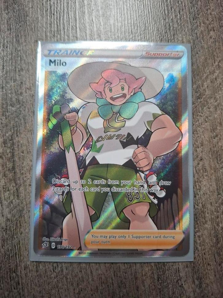 Trainer Milo Pokemon card Mint, Hobby en Vrije tijd, Verzamelkaartspellen | Yu-gi-Oh!, Zo goed als nieuw, Ophalen of Verzenden