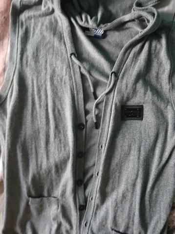 Nieuwe, grijze bodywarmer.  Maat XL.  beschikbaar voor biedingen