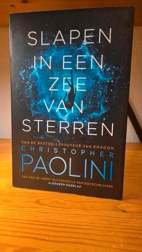 Christopher Paolini - Slapen in een zee van sterren, Boeken, Science fiction, Zo goed als nieuw, Ophalen of Verzenden
