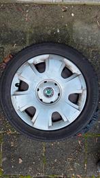 Continental winterbanden op stalen velgen Skoda wieldoppen, Ophalen