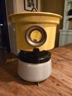 Kleine petroleum brander, Ophalen