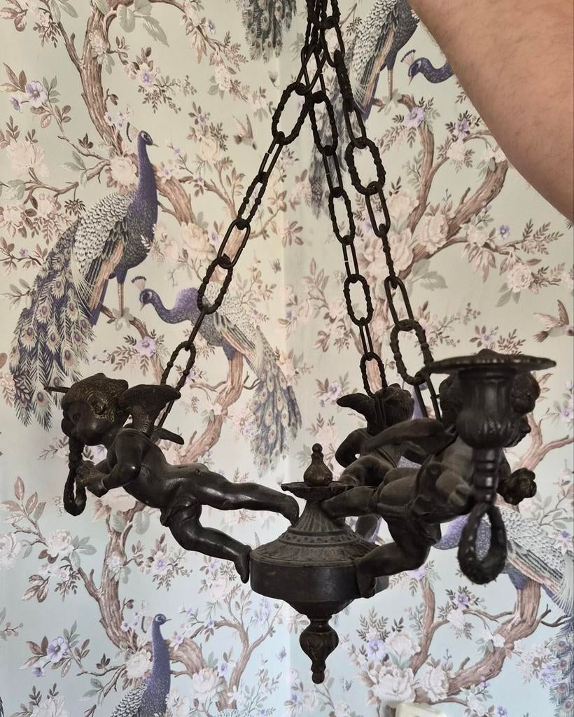 Bronzen luster cherubijnen, Ophalen