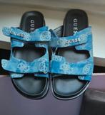 Guess nieuwe slippers., Kleding | Dames, Schoenen, Ophalen of Verzenden, Zo goed als nieuw