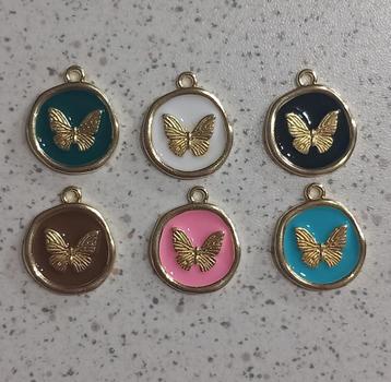 Metalen vlinder bedel rond "nieuw" beschikbaar voor biedingen