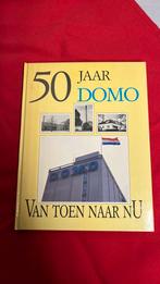 Boek 50 Jaar DOMO Van toen naar NU, Ophalen of Verzenden, Zo goed als nieuw