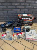Traxxas E Revo VXL 1/16 met accu en lader, reserveonderdelen, Elektro, Auto offroad, Ophalen of Verzenden, Zo goed als nieuw