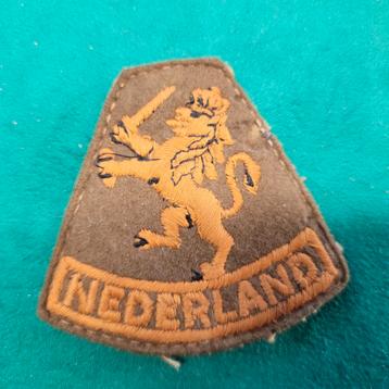 Mouwleeuw Ned.indië stof met verstevigde achtergrond beschikbaar voor biedingen