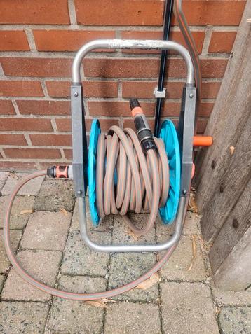 Tuinslanghaspel met slang beschikbaar voor biedingen