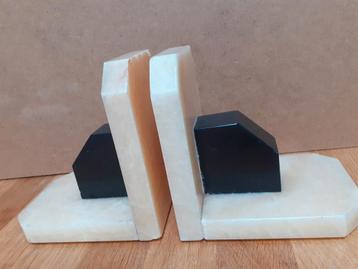 Stel Art Deco boekensteunen van marmer beschikbaar voor biedingen
