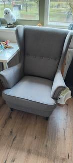 Grijze oorfauteuil met blauwe hoes, Ophalen