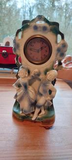 Antieke brisque porseleinen klok met figuren, Ophalen