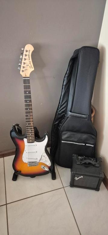 Nieuwe gitaar compleet met versterker en draagtas beschikbaar voor biedingen
