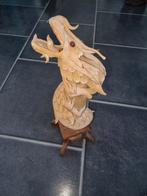 Houten draak, Ophalen