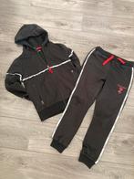 Touzani trainingspak maat 134-140, Ophalen of Verzenden, Zo goed als nieuw, Jongen, Sport- of Zwemkleding