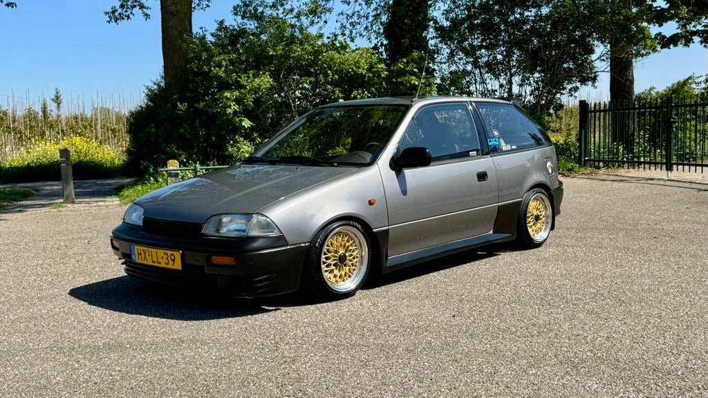 Suzuki Swift 1.3 Spirit AUT 1994 Grijs, Auto's, Stof, Sound system, Swift, Origineel Nederlands