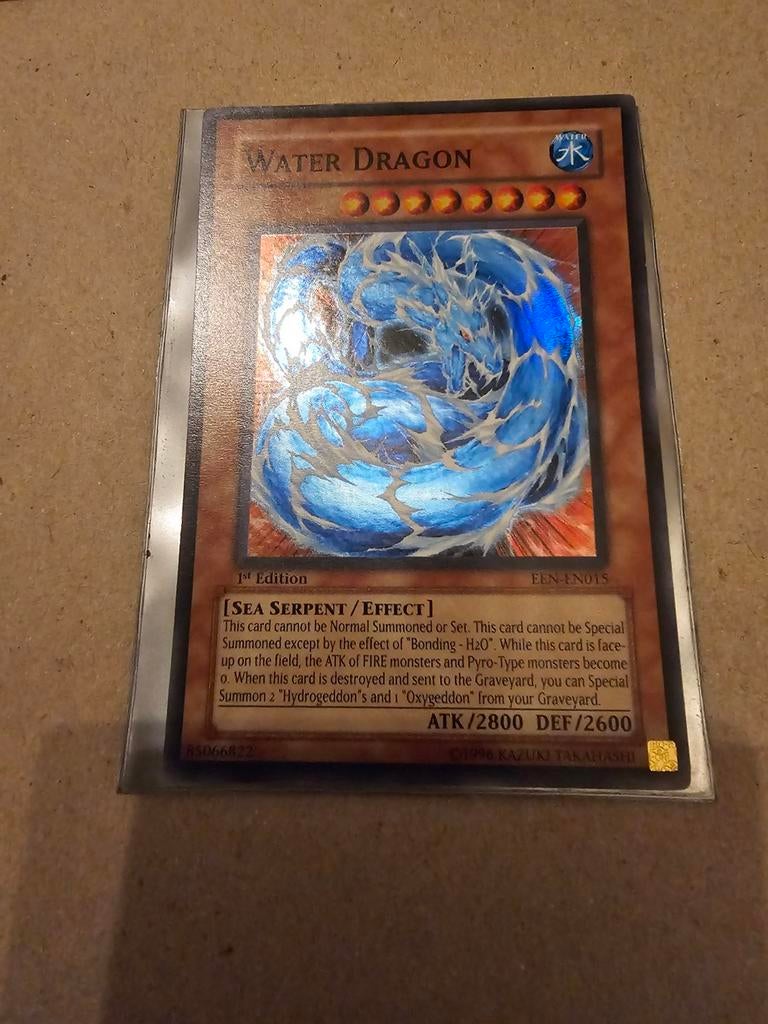 Yu-Gi-Oh! Water Dragon 1st Edition EEN-EN015, Ophalen of Verzenden, Zo goed als nieuw, Losse kaart, Foil