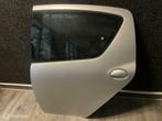 Toyota Aygo ('05-'14) Portier Deur Linksachter | 1E7, Ophalen of Verzenden, Gebruikt, Links, Deur