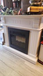 Witte schouw met elektrische haard, Ophalen