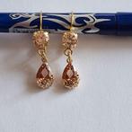 Goudkleurige oorbellen met bruine Swarovski elementen, Met kristal, Overige materialen, Hangers, Verzenden