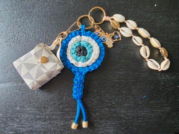 Sleutel- en/of tassenhanger met tasje beschikbaar voor biedingen