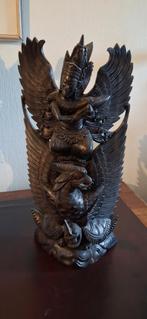 Houten Garuda Beeld, Ophalen