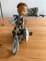 Opwindbaar speelgoed. Meisje op fiets met hond, Antiek en Kunst, Ophalen of Verzenden