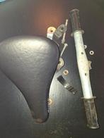 Zadel voor op stang (kinderzitje), Ophalen, Zadel