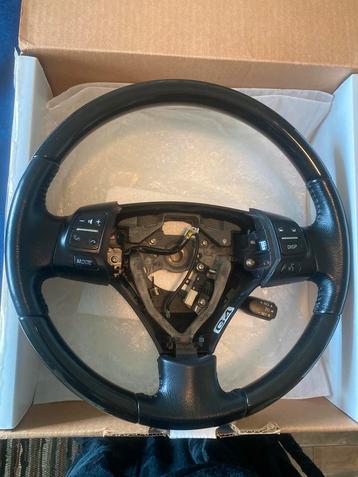 Stuurwiel met knoppen beschikbaar voor biedingen