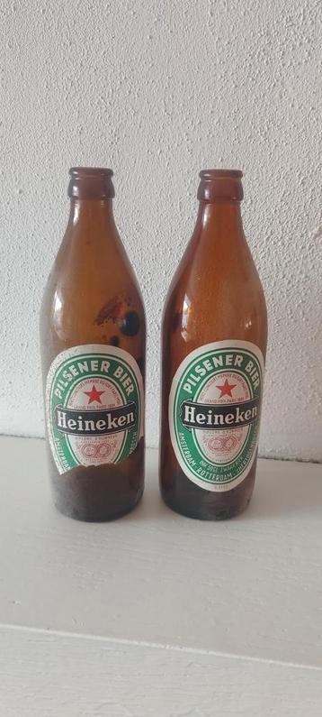 Oude Heineken fles halve liter beschikbaar voor biedingen