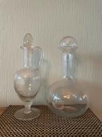 Twee glazen karaffen, Ophalen