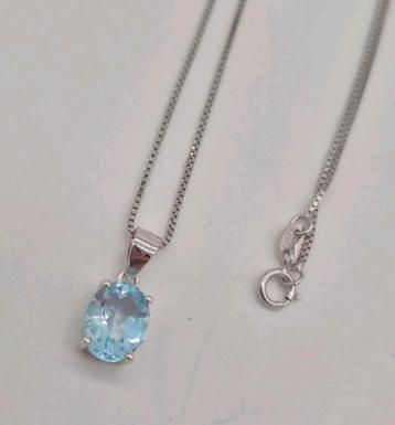 Mooie zilveren ketting met topaas beschikbaar voor biedingen