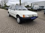 Peugeot 205 1.0 XE 1990 slechts 14.575 km!, Auto's, Oldtimers, Te koop, Grijs, Geïmporteerd, Bedrijf