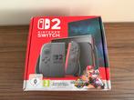Nieuw Nintendo Switch 2 + Mario World + bon en 2jr garantie!, Spelcomputers en Games, Ophalen, Nieuw, Met 2 controllers