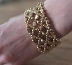 Prachtige goudkleurige mesh armband - Open gewerkt design, Kunststof of Plastic, Nieuw, Ophalen of Verzenden, Met bedels of kralen