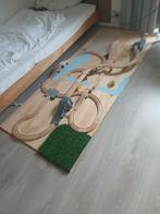 Treinbaan op houten plaat, Ophalen