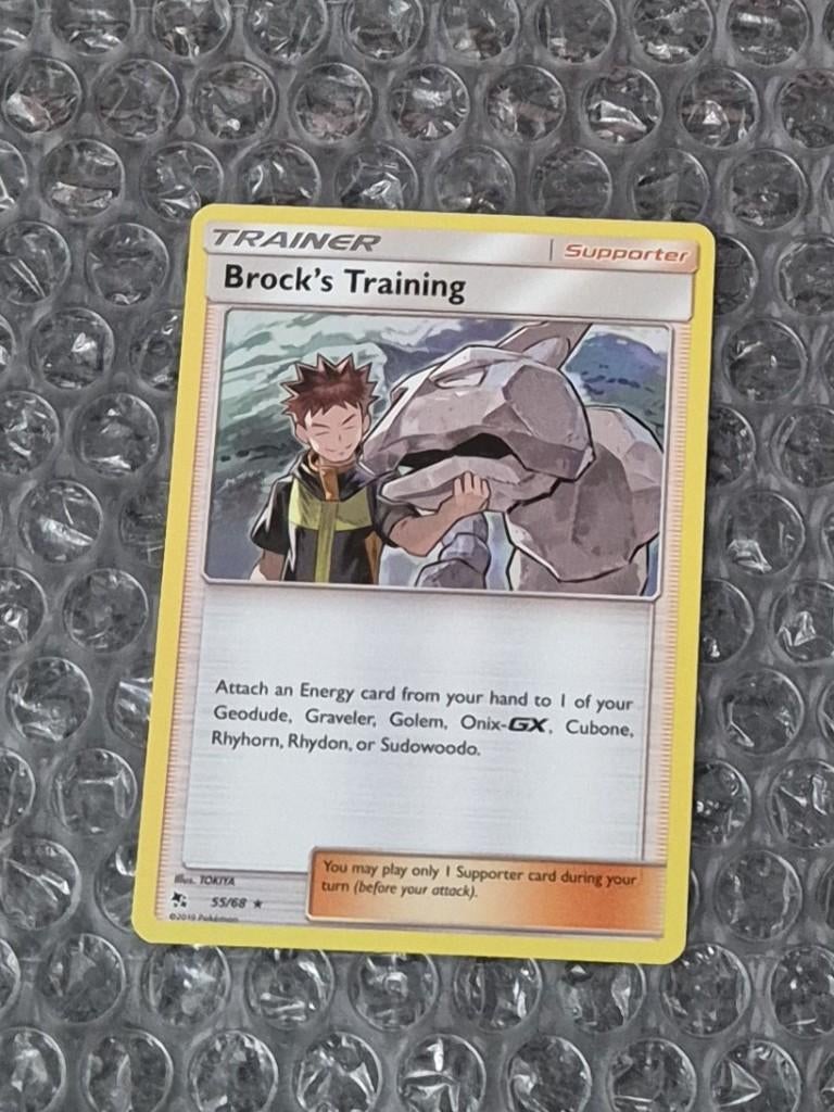 Holo Foil Brock's Training 55/68 Sun & Moon Hidden Fates, Ophalen of Verzenden, Zo goed als nieuw, Losse kaart, Foil