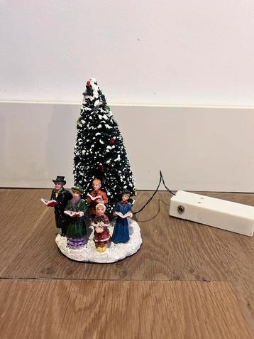 Kerstdorp zingend koor beschikbaar voor biedingen