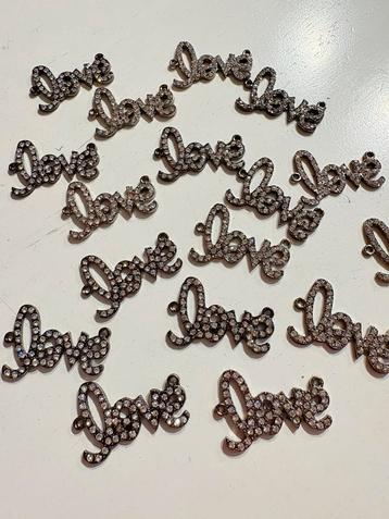 17 stuks love tussenzetsels zwart met rhinestone 35x22mm beschikbaar voor biedingen