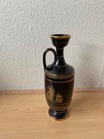 Zwarte Vaas met Gouden Details, Ophalen