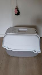 Iets grotere kattenbak, Ophalen