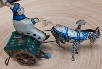Blikken clown op kar met paard beschikbaar voor biedingen