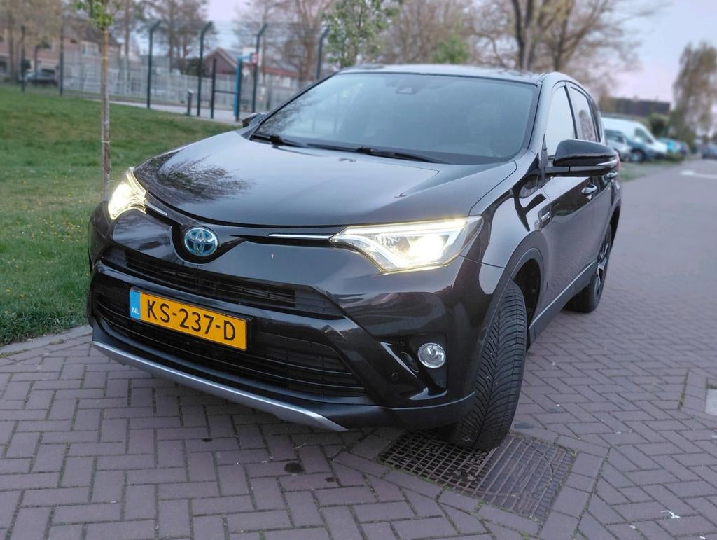 Toyota Rav4 2.5 Vvt-i Hybrid 155pk AWD Aut 2016 zwart NAP, Auto's, Euro 5, Leder en Stof, Zwart, Origineel Nederlands