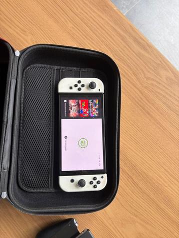 Nintendo switch OLED met extra controller en case evt ruil beschikbaar voor biedingen