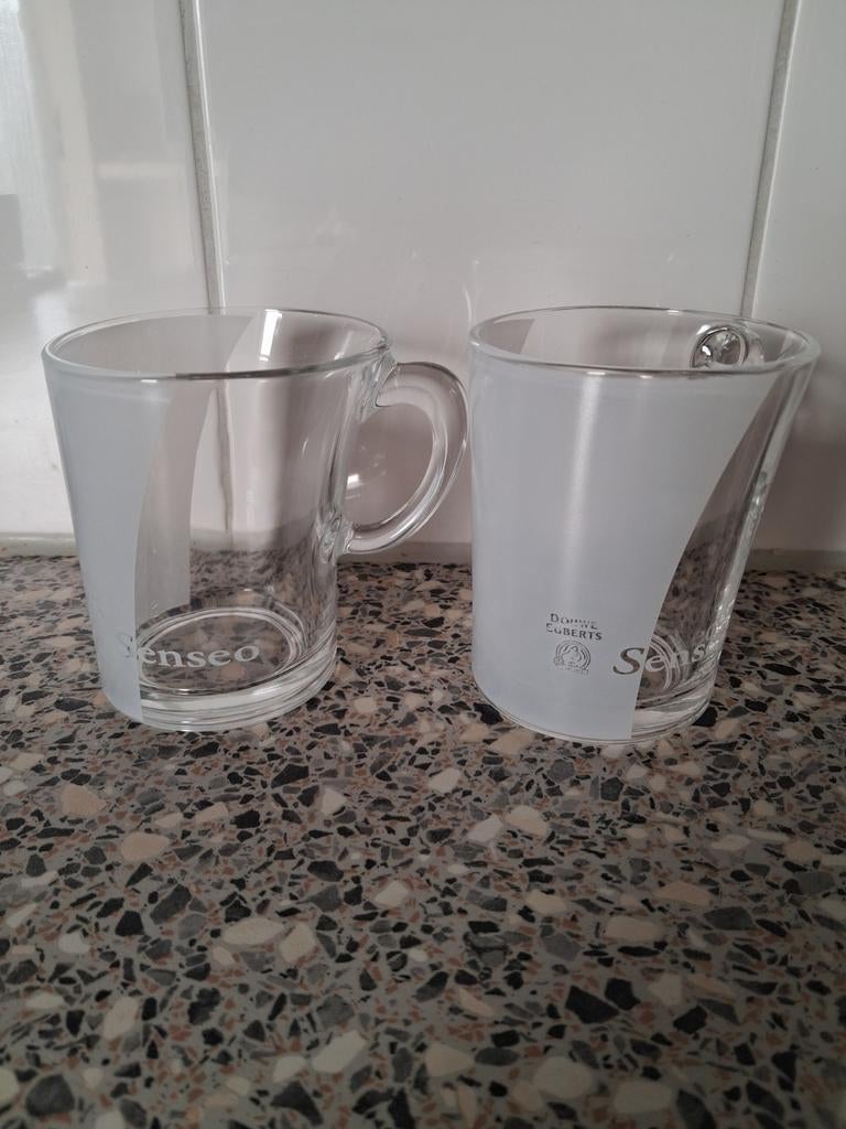 2 glazen Senseo kopjes z.g.a.n. van Douwe Egberts., Huis en Inrichting, Keuken | Servies, Ophalen, Glas, Overige stijlen, Kop(pen) en/of Schotel(s)