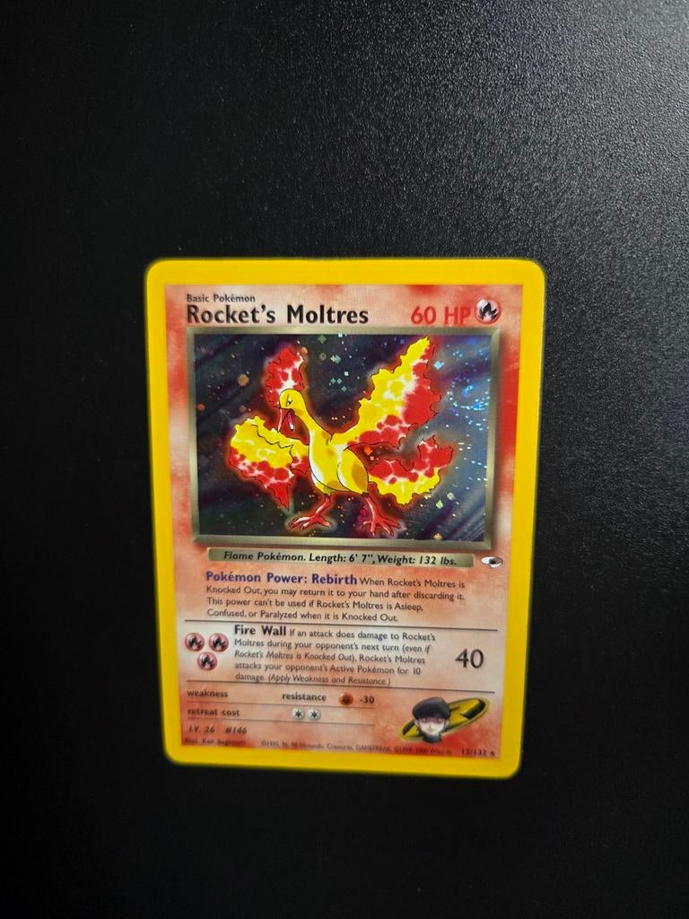 Rocket's Moltres holo 12/132 Pokemon Gym Heroes, Ophalen of Verzenden, Zo goed als nieuw, Booster, Foil